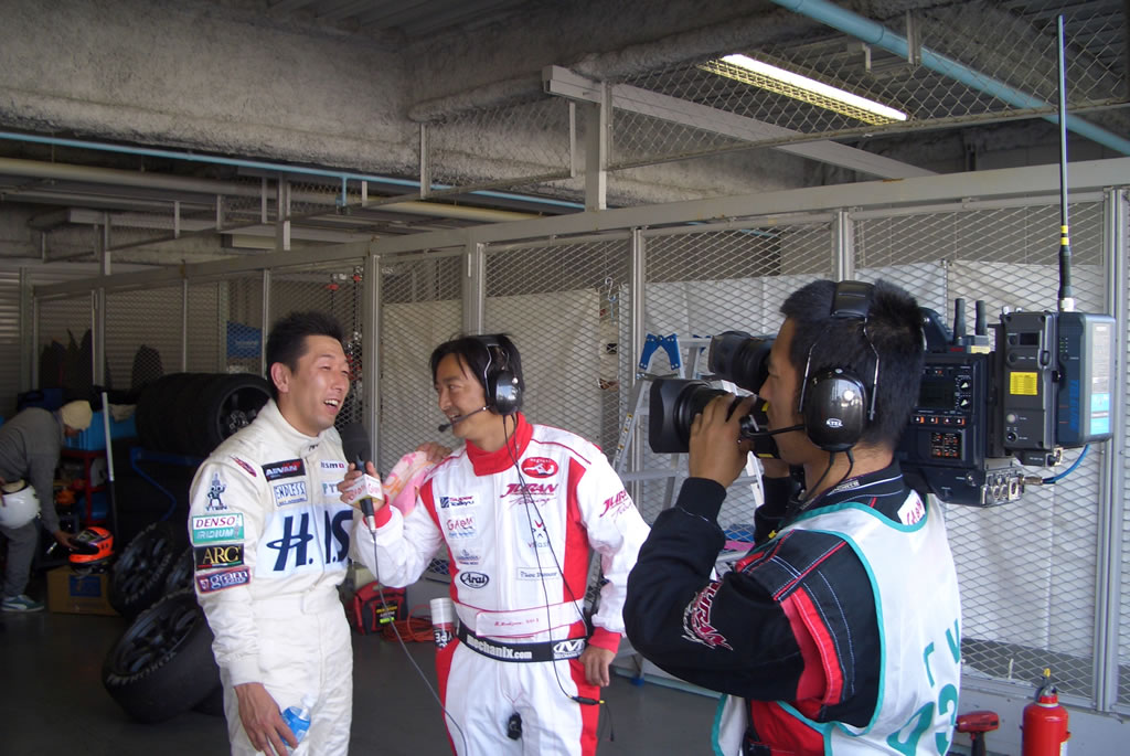 Maejima Shuji gets interviewed after his stint in the car at Suzuka.