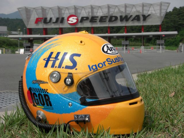 Igor Sushko's newly designed helmet, featurng the &quot;1gor&quot; logo and the H.I.S. Travel Agency sponsor logo.